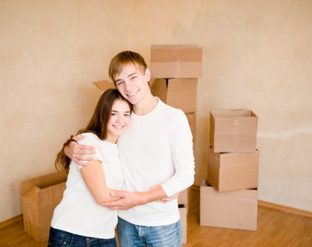 Professional movers preparing furniture for a local move